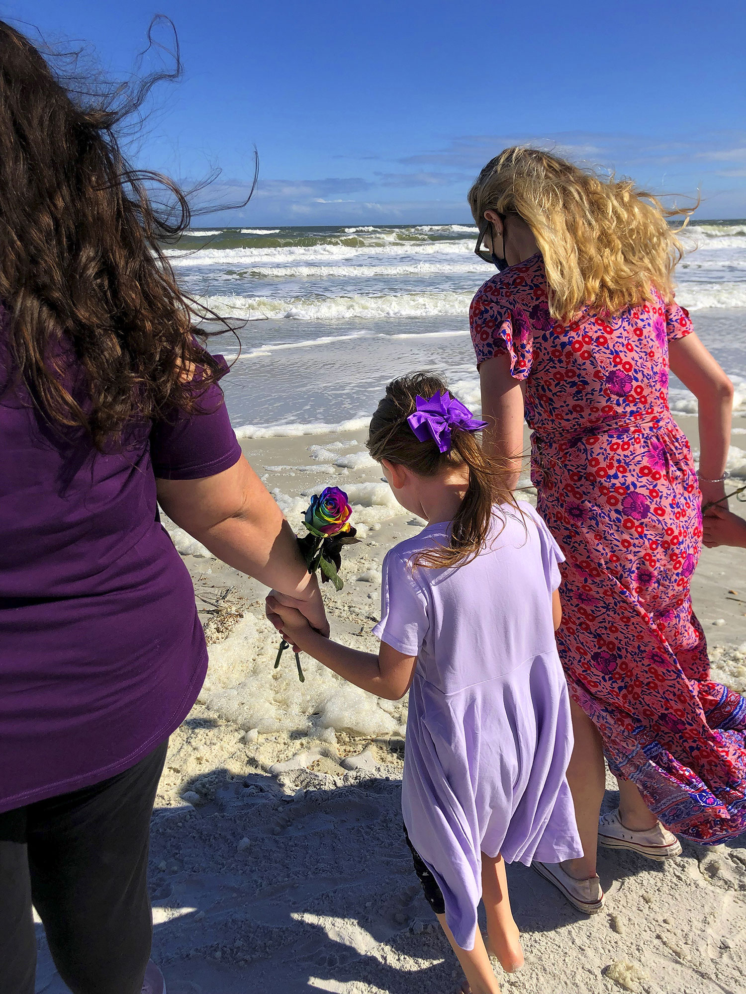 Child With Rose On Beach